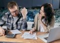 couple figuring out how to pay off debt