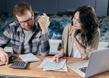 couple figuring out how to pay off debt