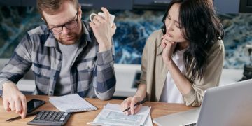 couple figuring out how to pay off debt