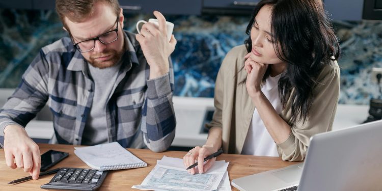 couple figuring out how to pay off debt